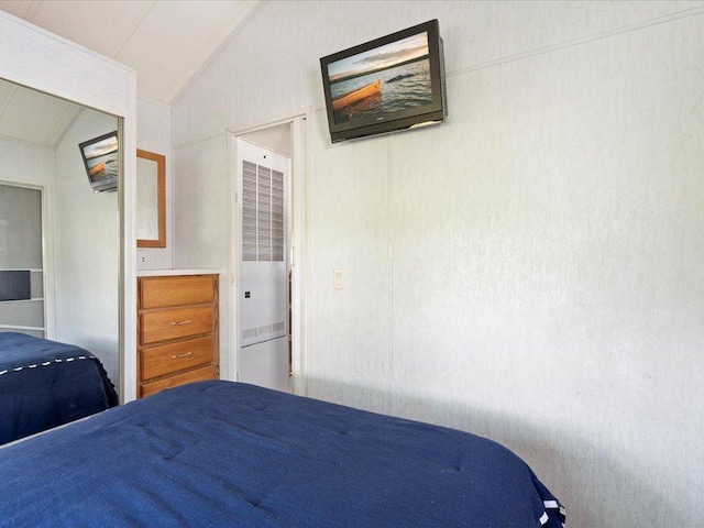 15827 Wilderness Trl Unit 30, Crosslake, MN 56442 - bedroom featuring a heating unit and vaulted ceiling