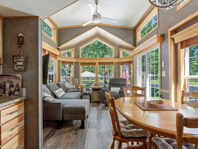 15827 Wilderness Trl Unit 112, Crosslake, MN 56442 - dining room with hardwood / wood-style flooring, ceiling fan, and high vaulted ceiling