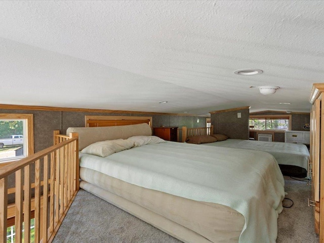 15827 Wilderness Trl Unit 112, Crosslake, MN 56442 - carpeted bedroom with vaulted ceiling and a textured ceiling