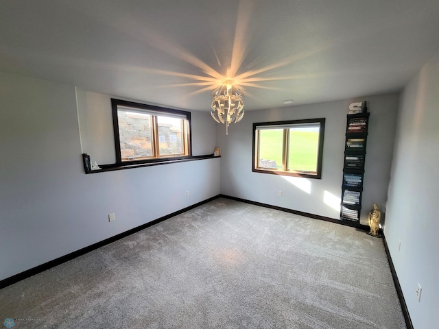 11003 Eagles Nest Ct, Audubon, MN 56511 - unfurnished room with carpet and a chandelier