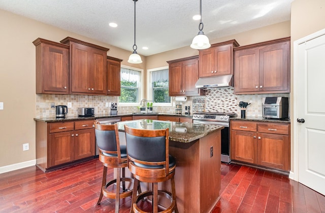 6274 Zircon Ln N, Maple Grove, MN 55311 - kitchen featuring appliances with stainless steel finishes, ventilation hood, dark wood-type flooring, recessed lighting, and tasteful backsplash