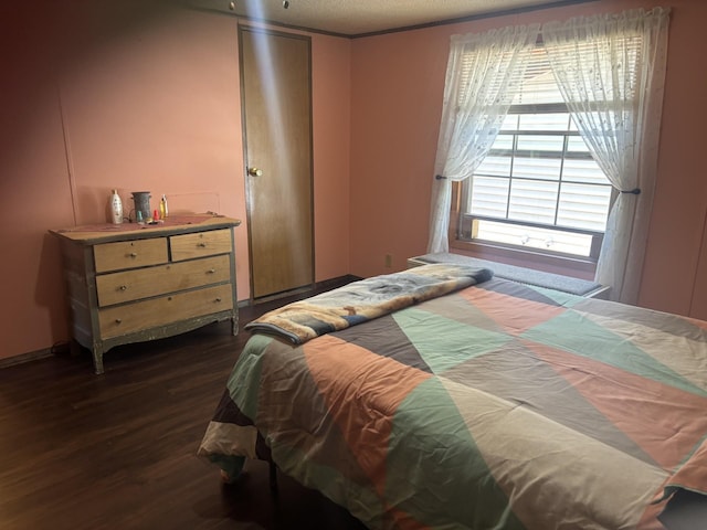 77165 Stepan Rd, Kettle River Twp, MN 55795 - bedroom with dark wood-type flooring and a textured ceiling
