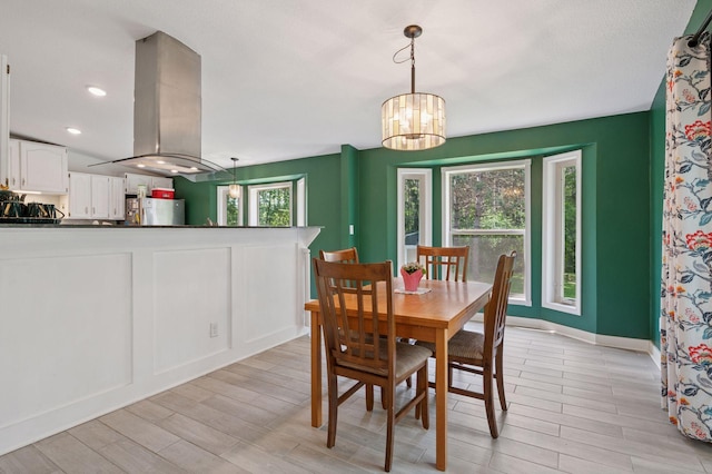990 221st Ave NW, Oak Grove, MN 55011 - dining room featuring light wood finished floors and a chandelier