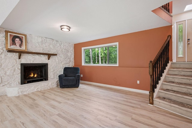 990 221st Ave NW, Oak Grove, MN 55011 - unfurnished room with stairs, wood finished floors, and a fireplace