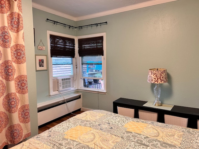 3821 Foss Rd, Saint Anthony, MN 55421 - bedroom featuring wood finished floors, radiator, ornamental molding, and cooling unit
