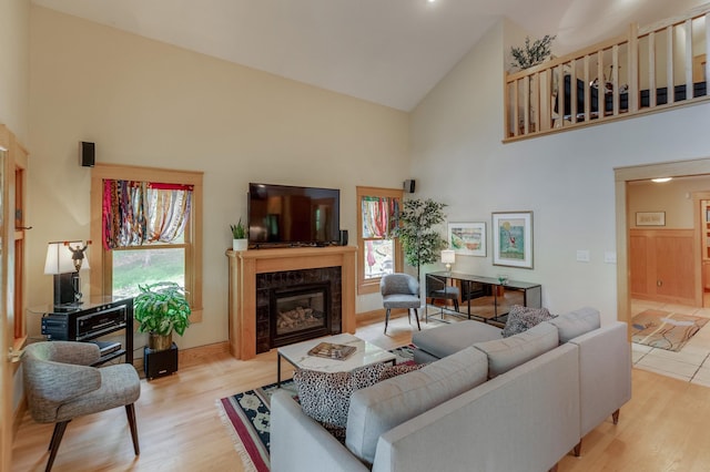 31767 Deacons Way, Pequot Lakes, MN 56472 - living room with high vaulted ceiling, healthy amount of natural light, a high end fireplace, and wood finished floors