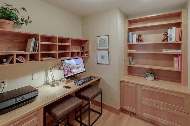 31767 Deacons Way, Pequot Lakes, MN 56472 - home office featuring light wood-style flooring and built in study area