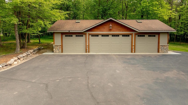 31767 Deacons Way, Pequot Lakes, MN 56472 - detached garage featuring a view of trees