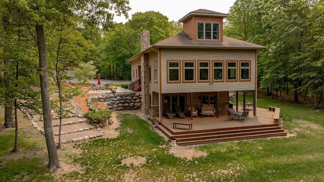 31767 Deacons Way, Pequot Lakes, MN 56472 - rear view of property featuring a chimney, a deck, and a yard