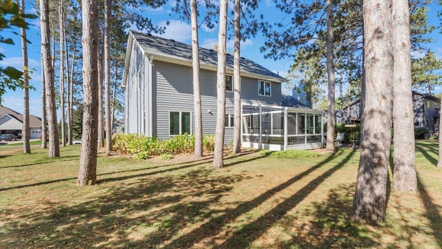 814 8th Ave N, Sartell, MN 56377 - rear view of house with a sunroom and a lawn