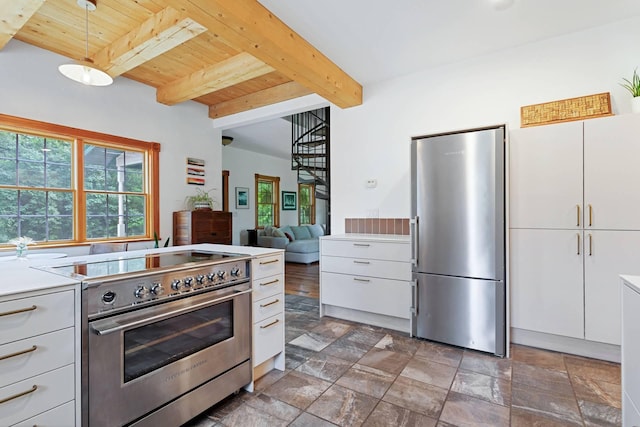 33245 Teal Ave, Shafer Twp, MN 55074 - kitchen with appliances with stainless steel finishes, a wooden ceiling with exposed beams, stone finish flooring, white cabinetry, and light countertops
