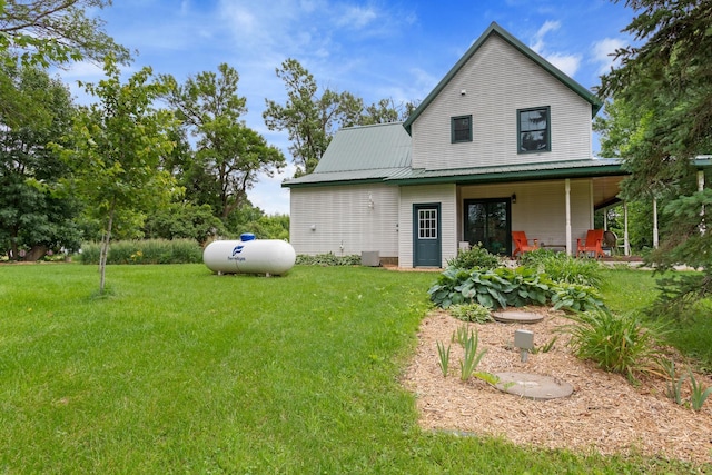 33245 Teal Ave, Shafer Twp, MN 55074 - rear view of property featuring a lawn and a metal roof