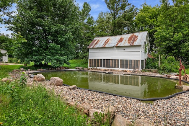 33245 Teal Ave, Shafer Twp, MN 55074 - view of swimming pool featuring an outbuilding and a garden pond