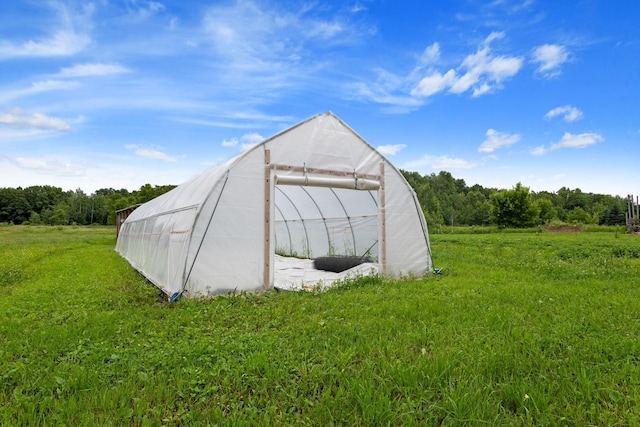 33245 Teal Ave, Shafer Twp, MN 55074 - view of greenhouse featuring a lawn