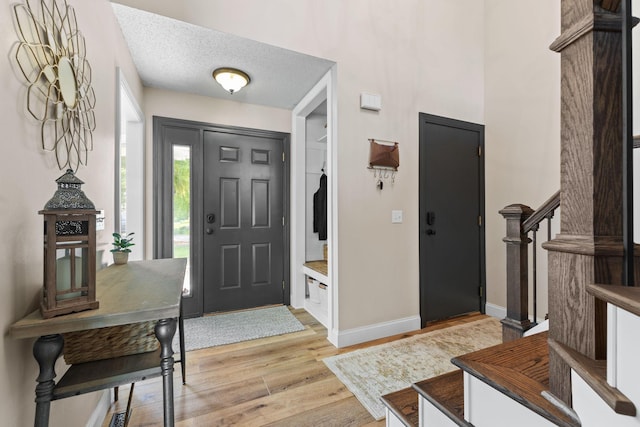 12816 95th Ave N, Maple Grove, MN 55369 - entrance foyer featuring light wood-style flooring and stairway