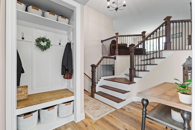 12816 95th Ave N, Maple Grove, MN 55369 - mudroom with wood finished floors and a chandelier