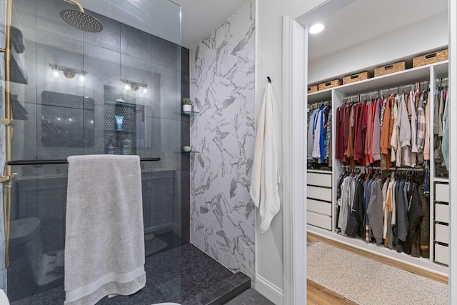 12816 95th Ave N, Maple Grove, MN 55369 - full bathroom with a shower with door, wood finished floors, and a spacious closet