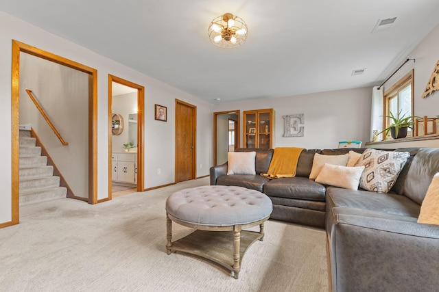 12816 95th Ave N, Maple Grove, MN 55369 - carpeted living area with stairs and baseboards