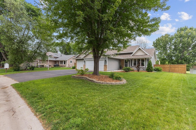 12816 95th Ave N, Maple Grove, MN 55369 - view of front of home featuring asphalt driveway, a garage, brick siding, and a shingled roof