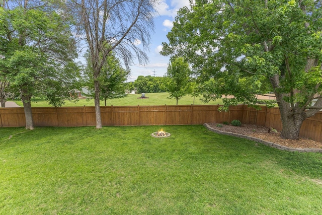 12816 95th Ave N, Maple Grove, MN 55369 - fenced backyard with an outdoor fire pit