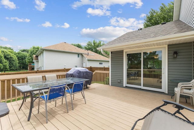12816 95th Ave N, Maple Grove, MN 55369 - wooden terrace with outdoor dining space and a grill