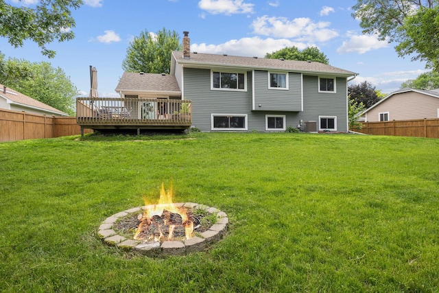 12816 95th Ave N, Maple Grove, MN 55369 - back of house featuring a deck, a chimney, and a fire pit