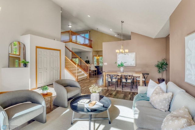 4375 58th St S, Fargo, ND 58104 - living room featuring stairs, high vaulted ceiling, wood finished floors, a chandelier, and recessed lighting