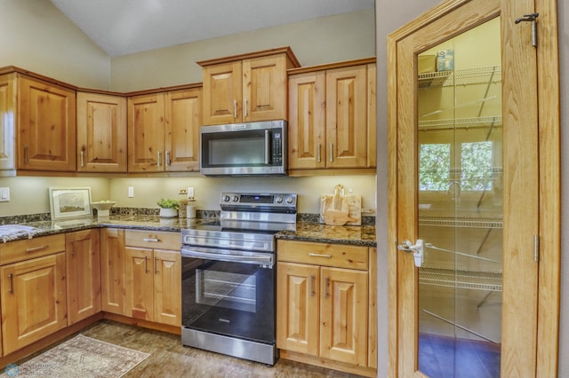 4375 58th St S, Fargo, ND 58104 - kitchen with appliances with stainless steel finishes and dark stone counters