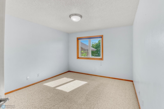 4375 58th St S, Fargo, ND 58104 - spare room with carpet floors and a textured ceiling