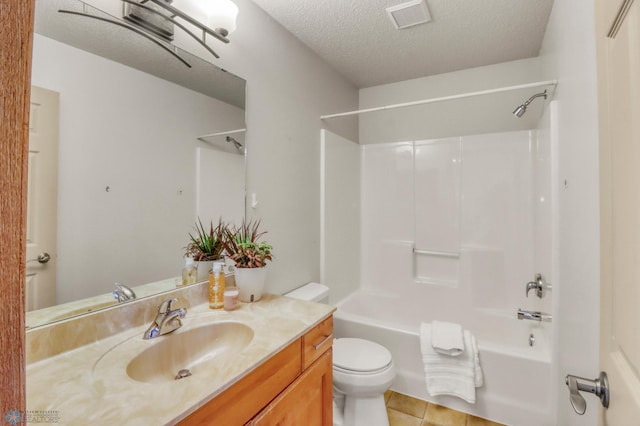 4375 58th St S, Fargo, ND 58104 - bathroom with bathing tub / shower combination, vanity, a textured ceiling, and tile patterned floors