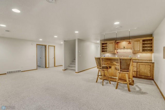 4375 58th St S, Fargo, ND 58104 - kitchen featuring open shelves, recessed lighting, decorative light fixtures, a kitchen breakfast bar, and light carpet