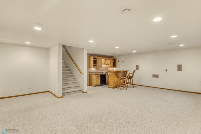 4375 58th St S, Fargo, ND 58104 - finished basement with wet bar, recessed lighting, light colored carpet, and stairway