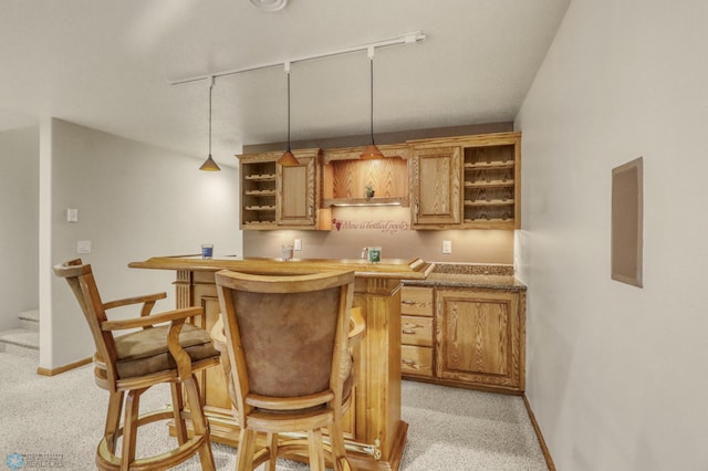 4375 58th St S, Fargo, ND 58104 - indoor wet bar with light carpet, pendant lighting, and stairs