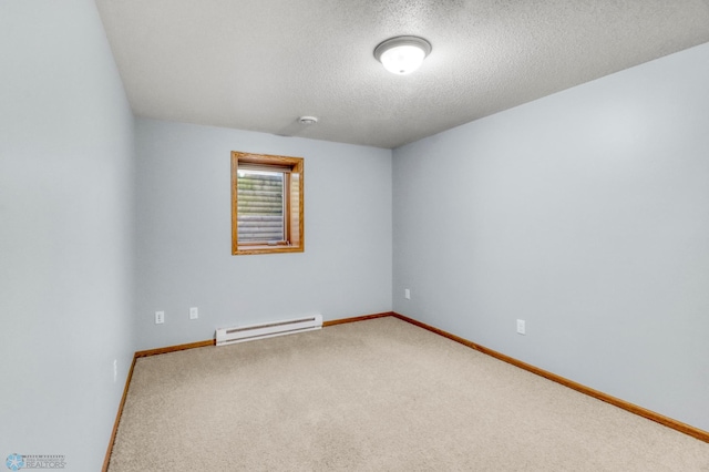 4375 58th St S, Fargo, ND 58104 - carpeted empty room featuring a baseboard radiator, a textured ceiling, and a smoke detector