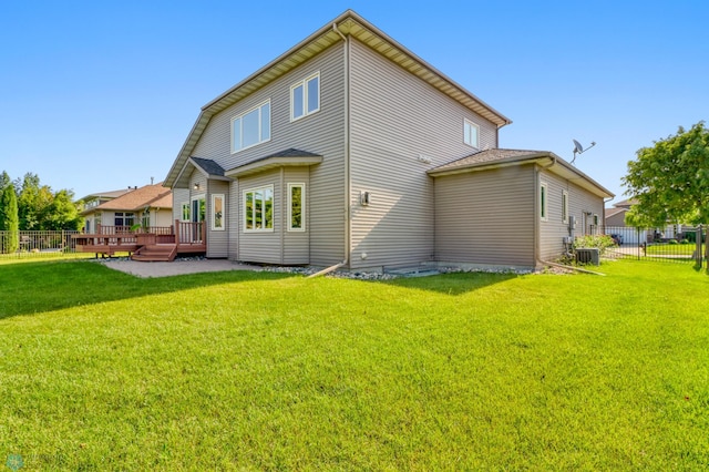 4375 58th St S, Fargo, ND 58104 - rear view of house featuring a fenced backyard and a wooden deck