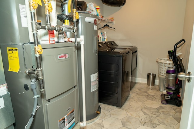 8704 Park Ave, Otsego, MN 55330 - utility room with heating unit, separate washer and dryer, and electric water heater