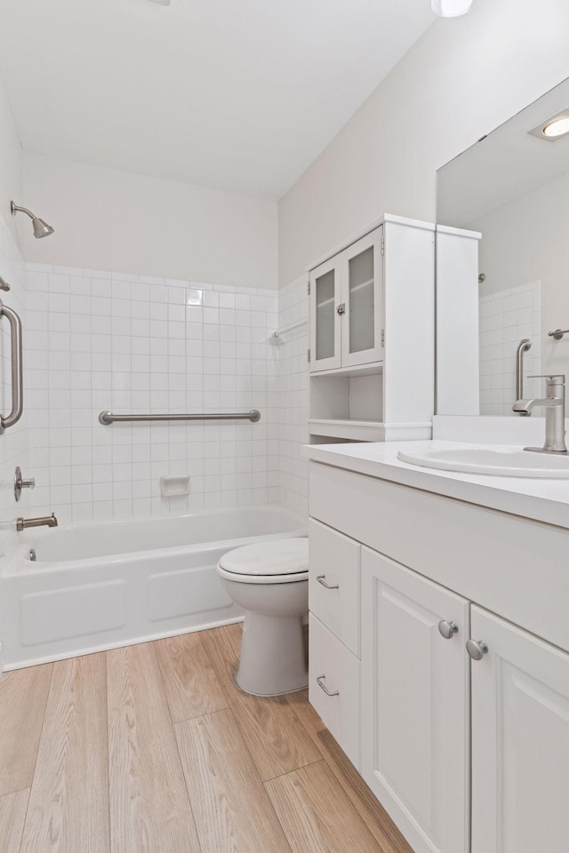 4100 Parklawn Ave Unit 118, Edina, MN 55435 - full bathroom with bathing tub / shower combination, vanity, and wood finished floors