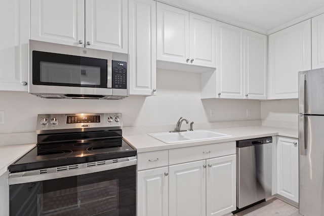 4100 Parklawn Ave Unit 118, Edina, MN 55435 - kitchen with appliances with stainless steel finishes, white cabinetry, and light countertops