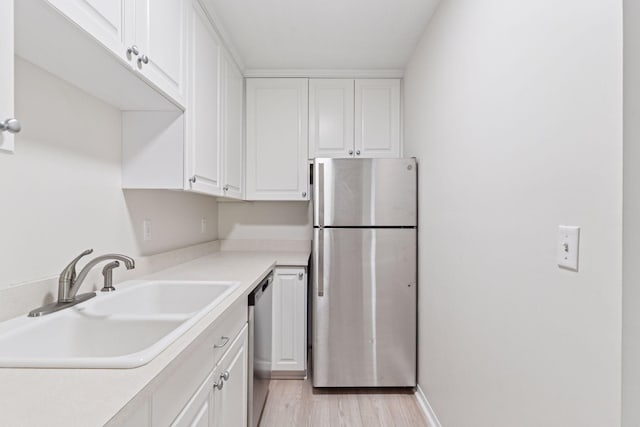 4100 Parklawn Ave Unit 118, Edina, MN 55435 - kitchen with stainless steel appliances, white cabinets, and light countertops