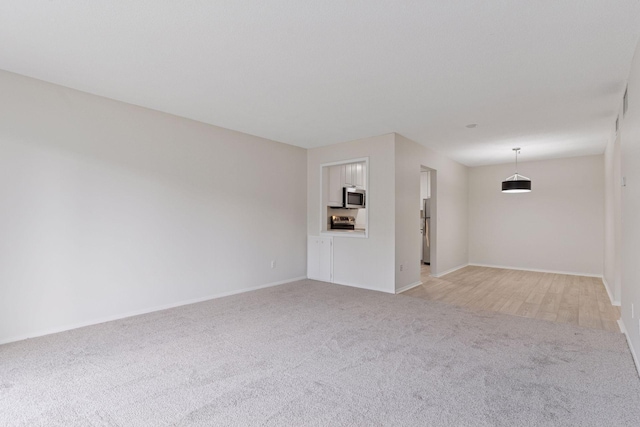 4100 Parklawn Ave Unit 118, Edina, MN 55435 - unfurnished living room with light carpet and baseboards