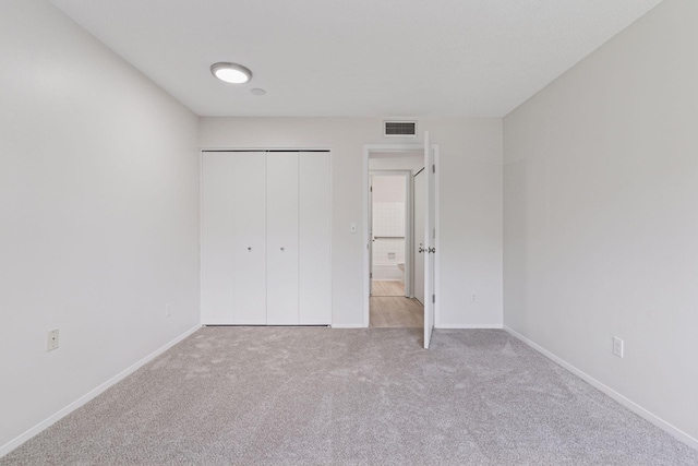 4100 Parklawn Ave Unit 118, Edina, MN 55435 - unfurnished bedroom featuring carpet flooring and a closet