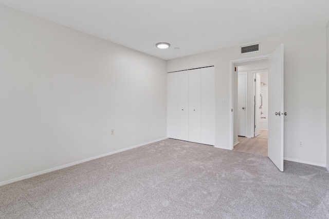 4100 Parklawn Ave Unit 118, Edina, MN 55435 - unfurnished bedroom featuring light carpet and a closet
