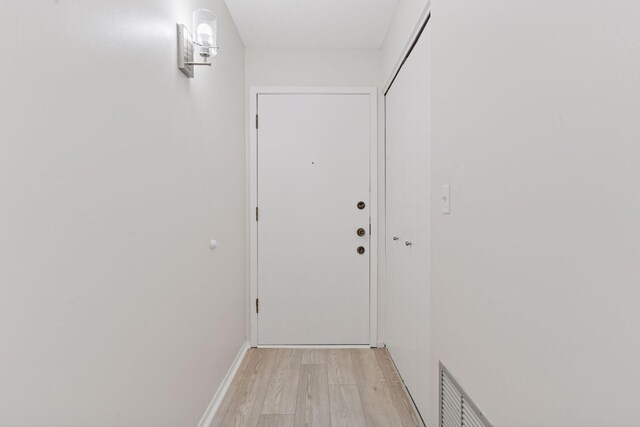 4100 Parklawn Ave Unit 118, Edina, MN 55435 - hallway featuring light wood finished floors and baseboards