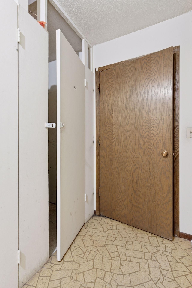 4100 Parklawn Ave Unit 118, Edina, MN 55435 - hallway featuring a textured ceiling