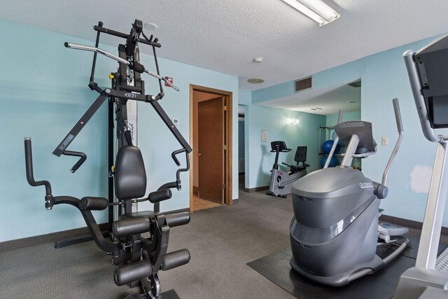 4100 Parklawn Ave Unit 118, Edina, MN 55435 - workout room with baseboards and a textured ceiling