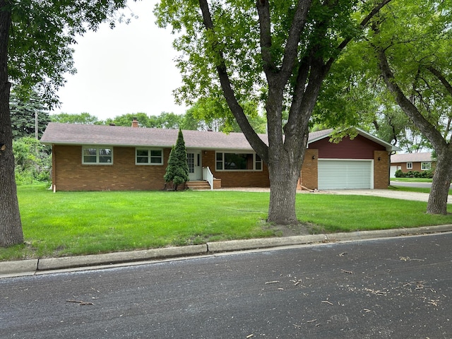 402 6th St NE, Barnesville, MN 56514 - ranch-style house with brick siding, entry steps, a chimney, and a front yard