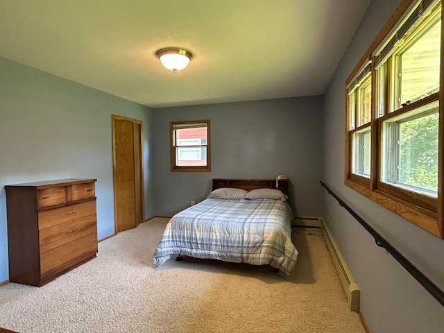 402 6th St NE, Barnesville, MN 56514 - bedroom with carpet and a baseboard heating unit