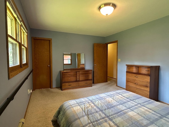 402 6th St NE, Barnesville, MN 56514 - bedroom with light carpet and baseboard heating