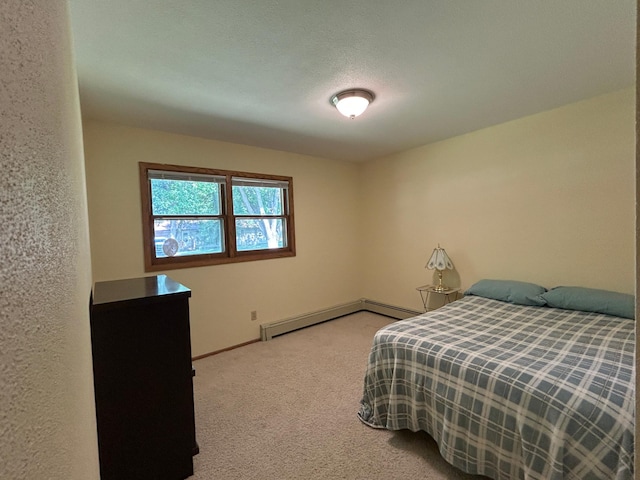 402 6th St NE, Barnesville, MN 56514 - bedroom with carpet flooring and baseboard heating
