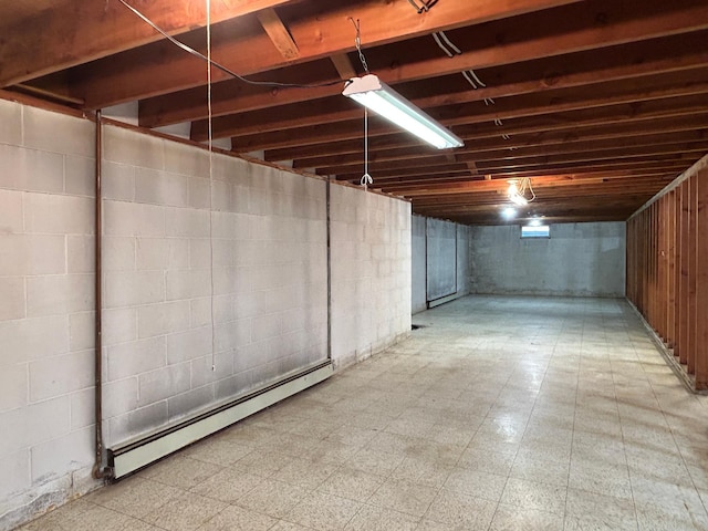 402 6th St NE, Barnesville, MN 56514 - basement featuring a baseboard heating unit and tile patterned floors